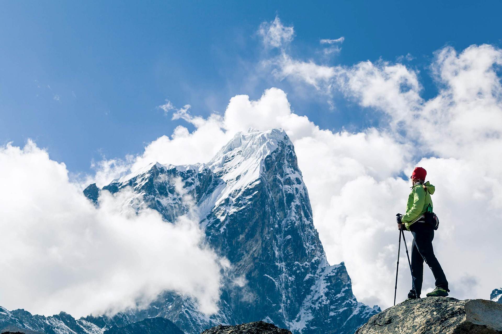 Young woman hiker hiking in Himalaya Mountains in Nepal. 